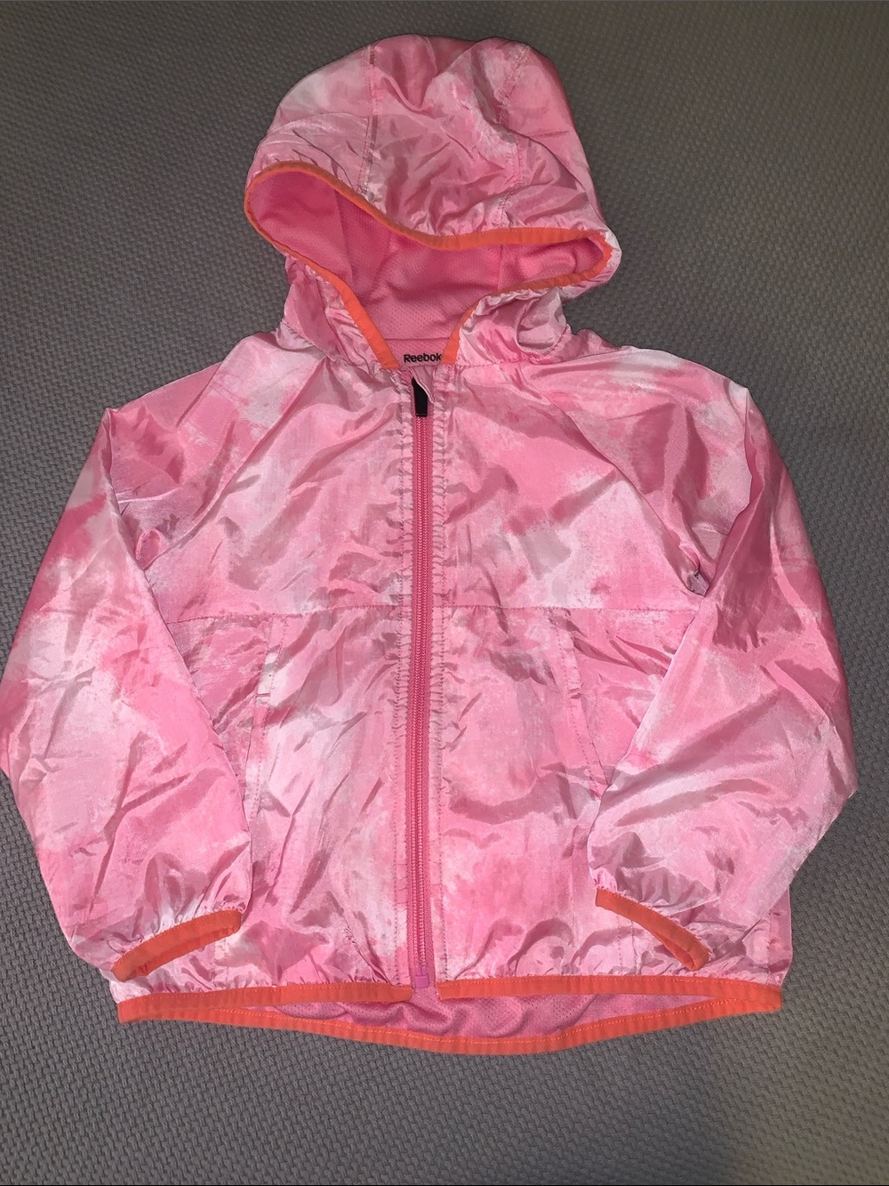 Reebok Pink Hooded Kids Rain Jacket with Orange Trim